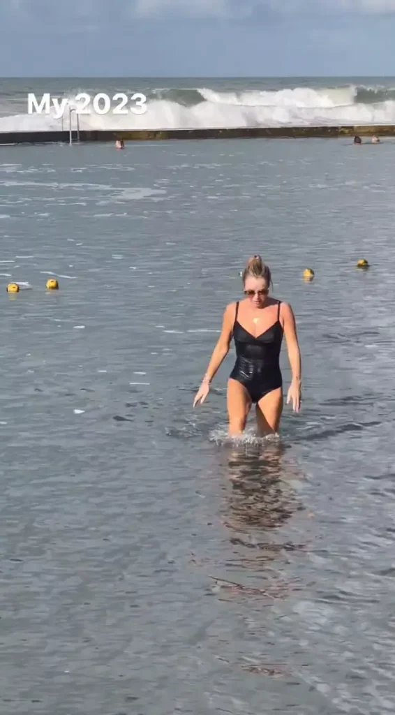 In another photo, Amanda was dripping wet as she emerged from the ocean wearing a black swimming costume, which adhered perfectly to her body.