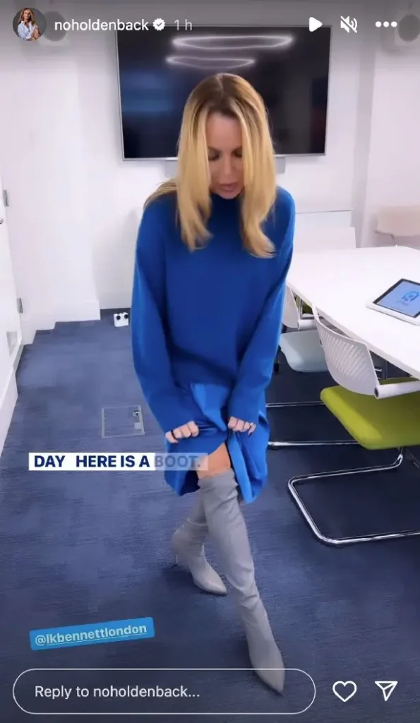 Amanda Holden appears nothing short of sensational in clingy satin skirt and blue jumper while flashing endless legs