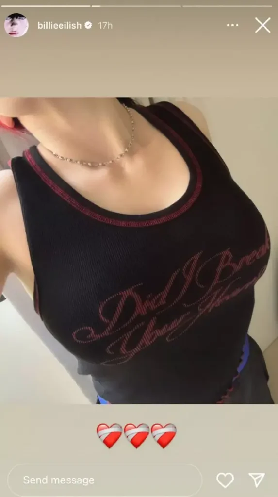 Wearing a black vest top with red embroidery, she displayed her hourglass figure and featured a message across the front, “Did I break your heart?”