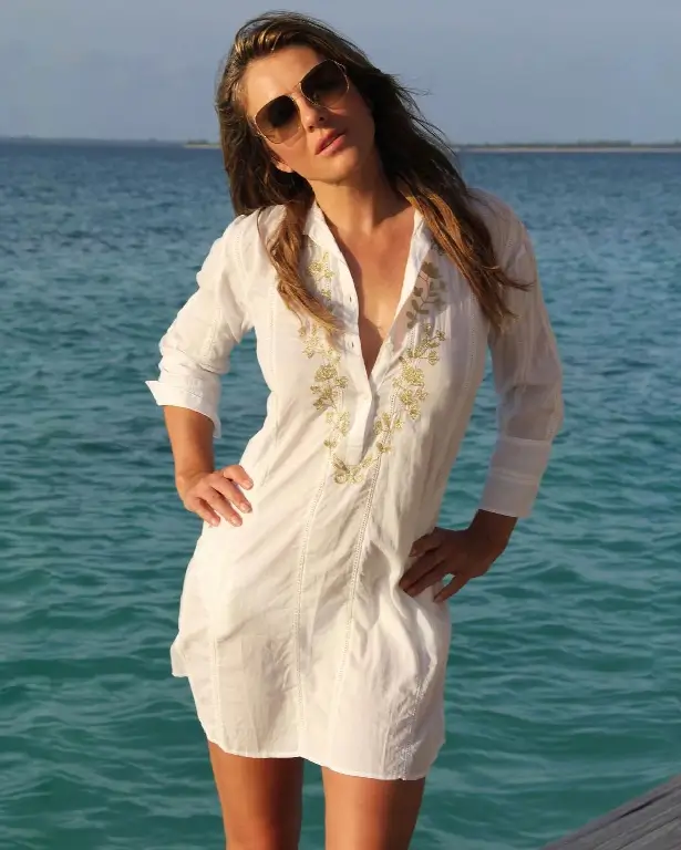 A series of sizzling hot snaps from Liz Hurley captivated her loyal legion of fans as she wows in see-through shirt dress and braless in a sun-drenched photo.