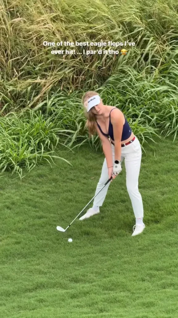 In a plunging navy crop top, Grace Charis shows off her amazing figure as she boasts of her best performance on the course