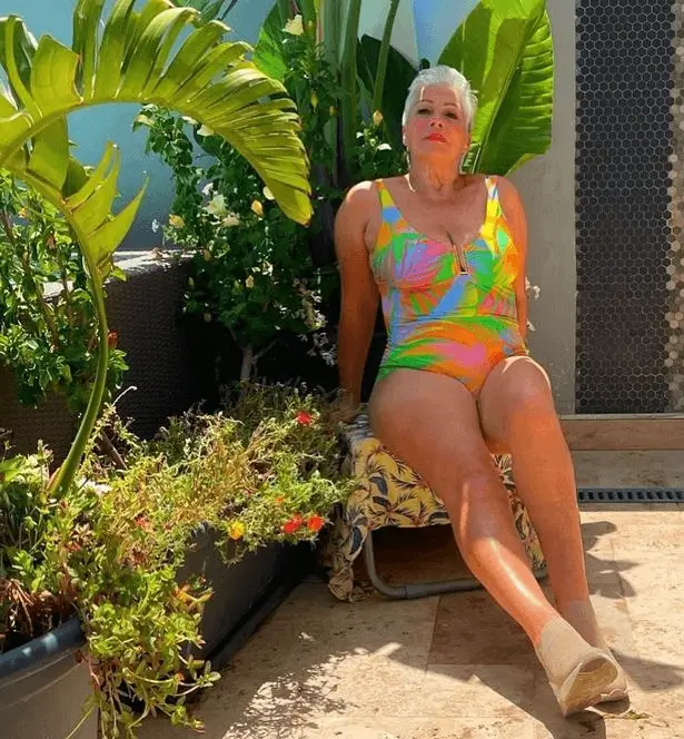 Last July, Denise Welch posted a photo on Instagram of herself in a colorful swimsuit while posing in a sunny garden.