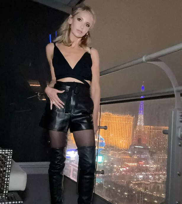 A pair of black leather hot pants and a crop top show off Sarah Michelle Gellar's killer figure, posing in her hotel room before she hits Las Vegas to paint the town red.