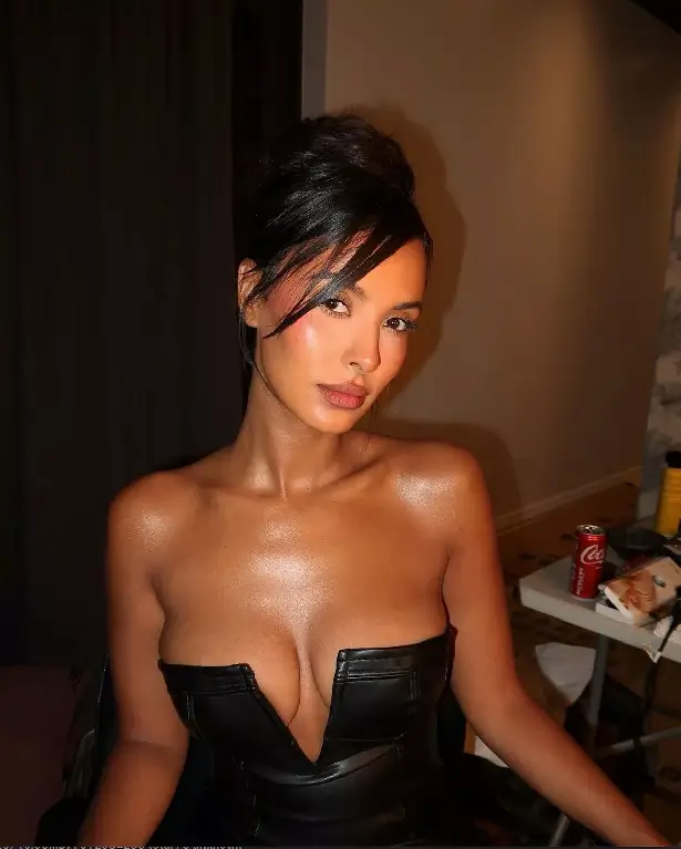 In a new shoot, Maya Jama wore a plunging black dress with a sophisticated updo, and fans called it a "thirst trap."
