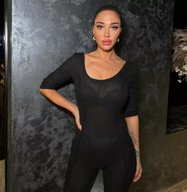 With a sheer black jumpsuit that clung to her figure like a second skin, Tulisa made sure all eyes were on her.