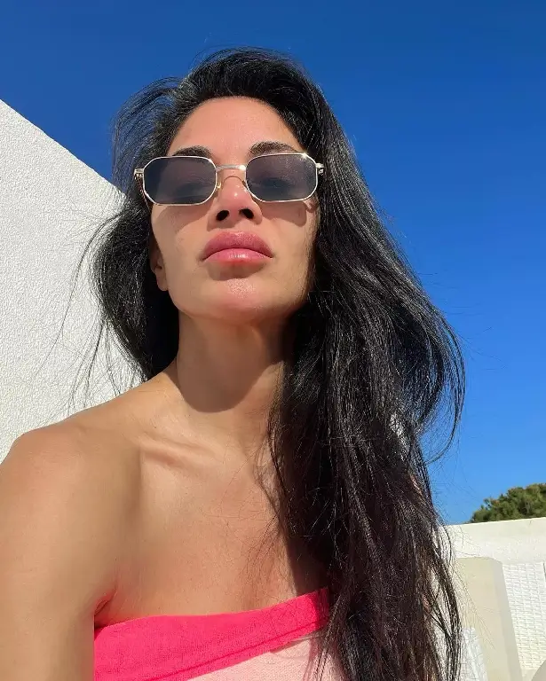 She also shared another picture, a close-up, makeup-free selfie in pink bandeau top and silver sunglasses while pouting. An additional picture showed Nicole with her knees pulled up to her chest while smiling.