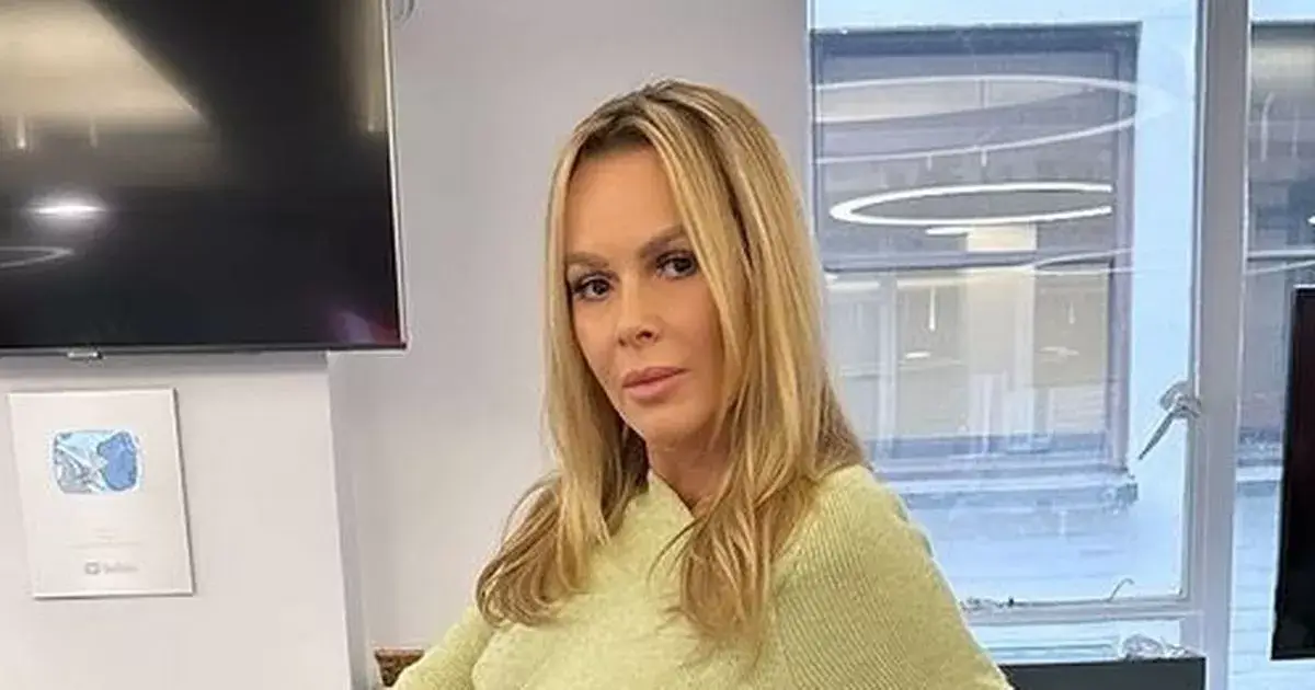Amanda Holden, 54, went braless in a skinny cut-out dress and admits ‘it is chilly’ when she strutted around the studios