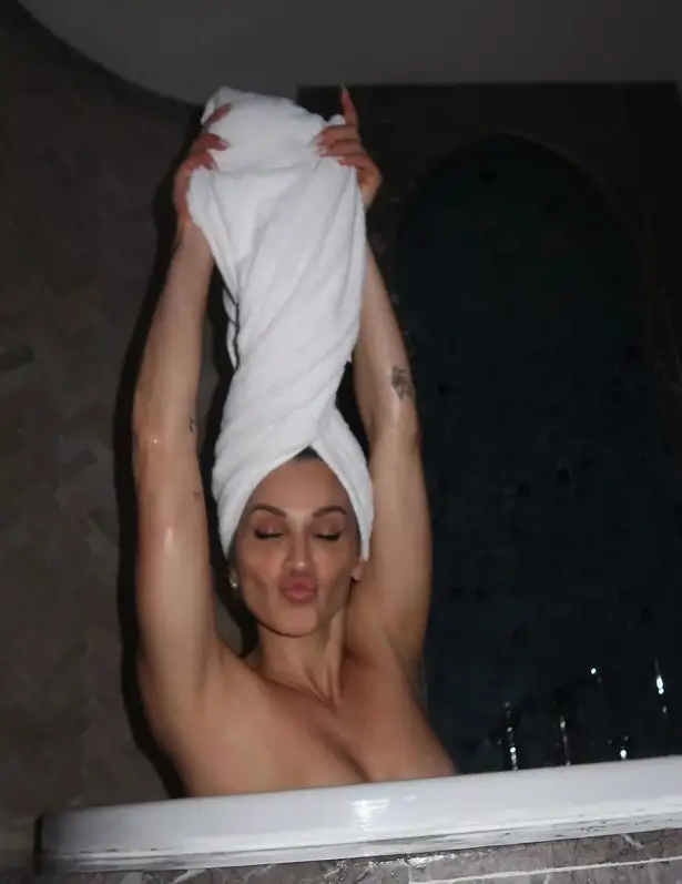 In the spa tub, Ashley Roberts raised her toned arms in the air while enjoying a traditional Moroccan spa treatment.