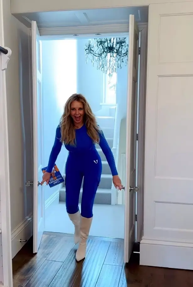 Carol Vorderman had fans piling the compliments high after she featured her curves in a clingy blue top and matching bottoms for a slow motion video - and they couldn't get enough of her.