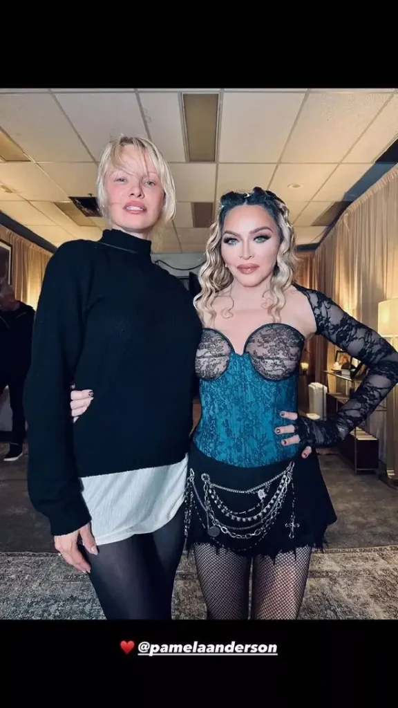 A second picture showed Madonna and Pamela backstage posing together as Madonna wrapped her arm around the Barb Wire star's waist.
