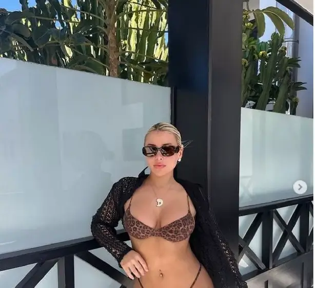 Love Island star Ellie Brown sent temperatures soaring with a tiny leopard print bikini that showed off her curves.