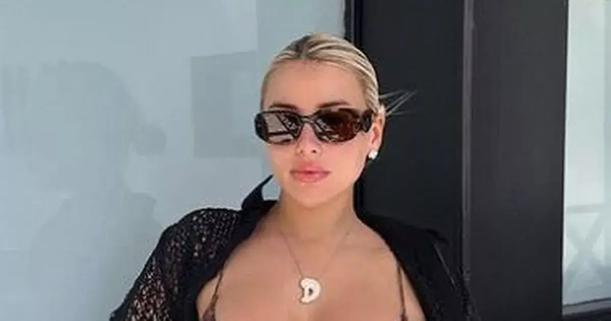 Fans swoon as Ellie Brown strips to reveal a tiny leopard print bikini to show off her curves Fans swoon as Ellie Brown strips to reveal a tiny leopard print bikini to show off her curves