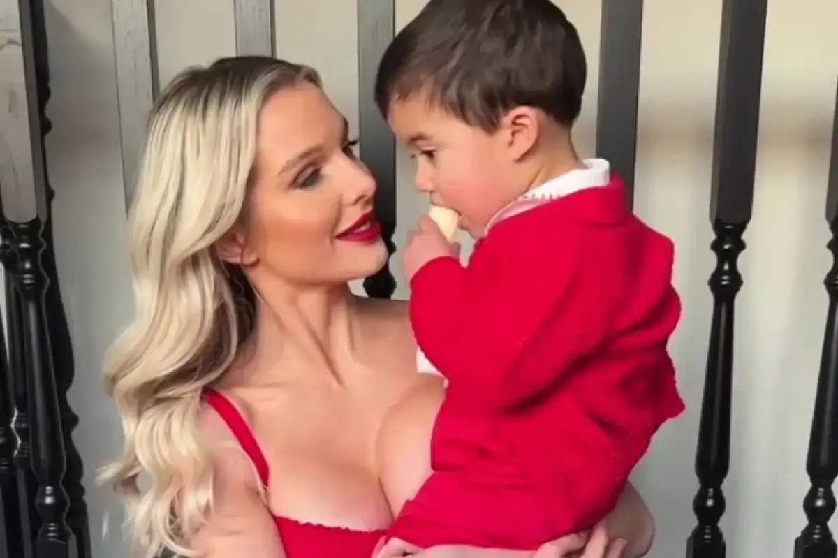Helen Flanagan, 33, stuns in plunging red dress as she poses with baby son