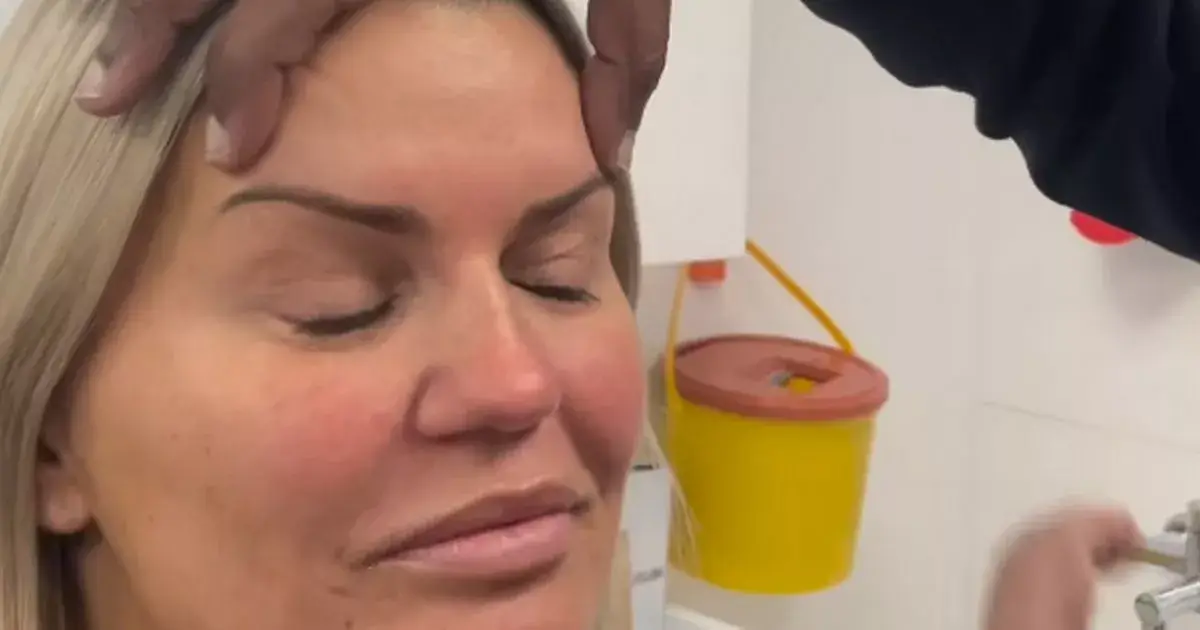 Kerry Katona looked stunning in a silver backless jumpsuit as she showcased her completely reshaped face after eyelid surgery