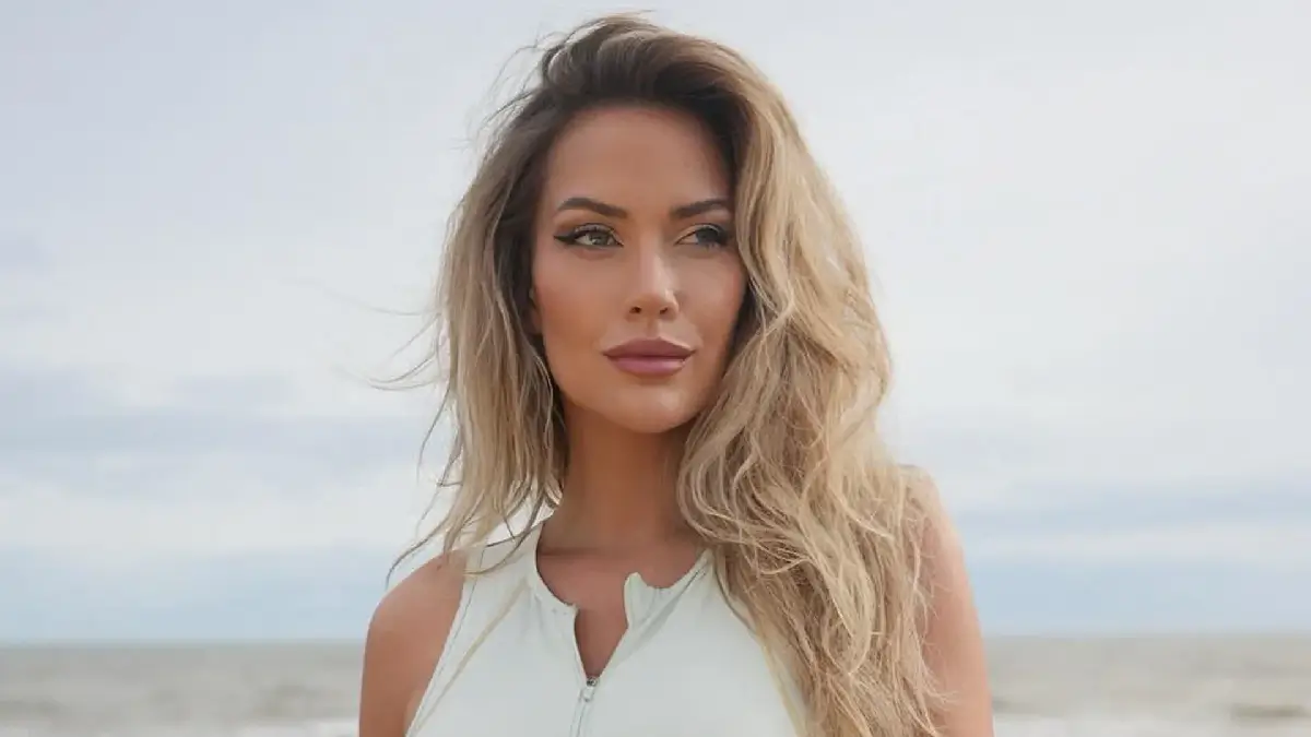 Paige Spiranac goes braless and showed off her toned abs in a revealing white top while sharing a strange request from fans