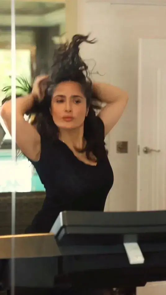 With tight pants and a tank, Salma Hayek dances just like queen Shakira for a sizzling video