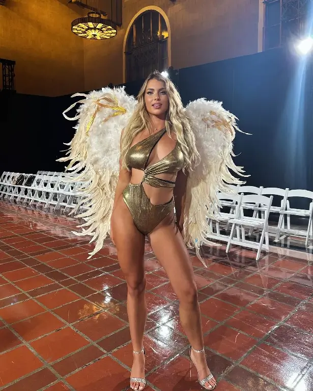 As Andreea Dragoi walked for Krissy King at LA Fashion Week in a gold-strappy bikini and angel wings, adoring fans dubbed her "Goddess" .