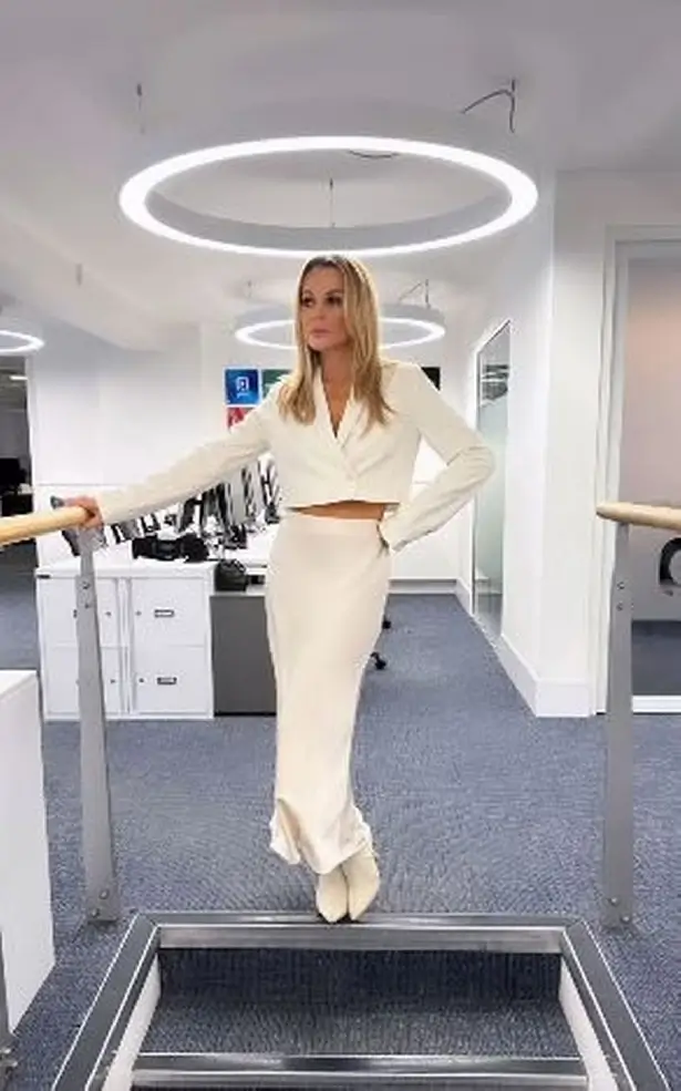In a slinky two-piece outfit, Amanda Holden wowed fans with her flawless figure as she paraded around the office on her social media.