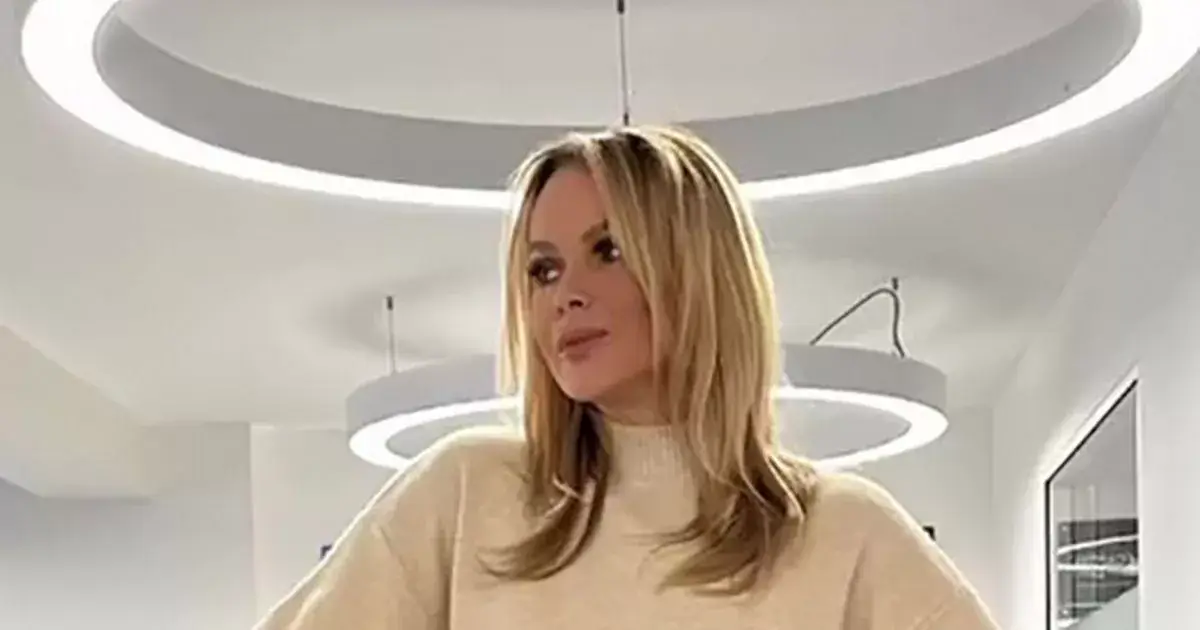 As Amanda Holden, 53, raises her silk satin skirt and ditches her bra, she almost flashes her knickers As Amanda Holden, 53, raises her silk satin skirt and ditches her bra, she almost flashes her knickers