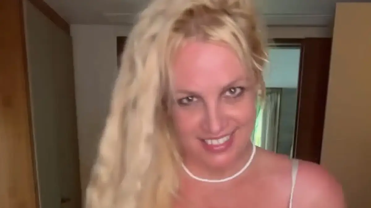 In a bizarre video, Britney Spears is wearing body-hugging white underwear that barely covers her chest and backside