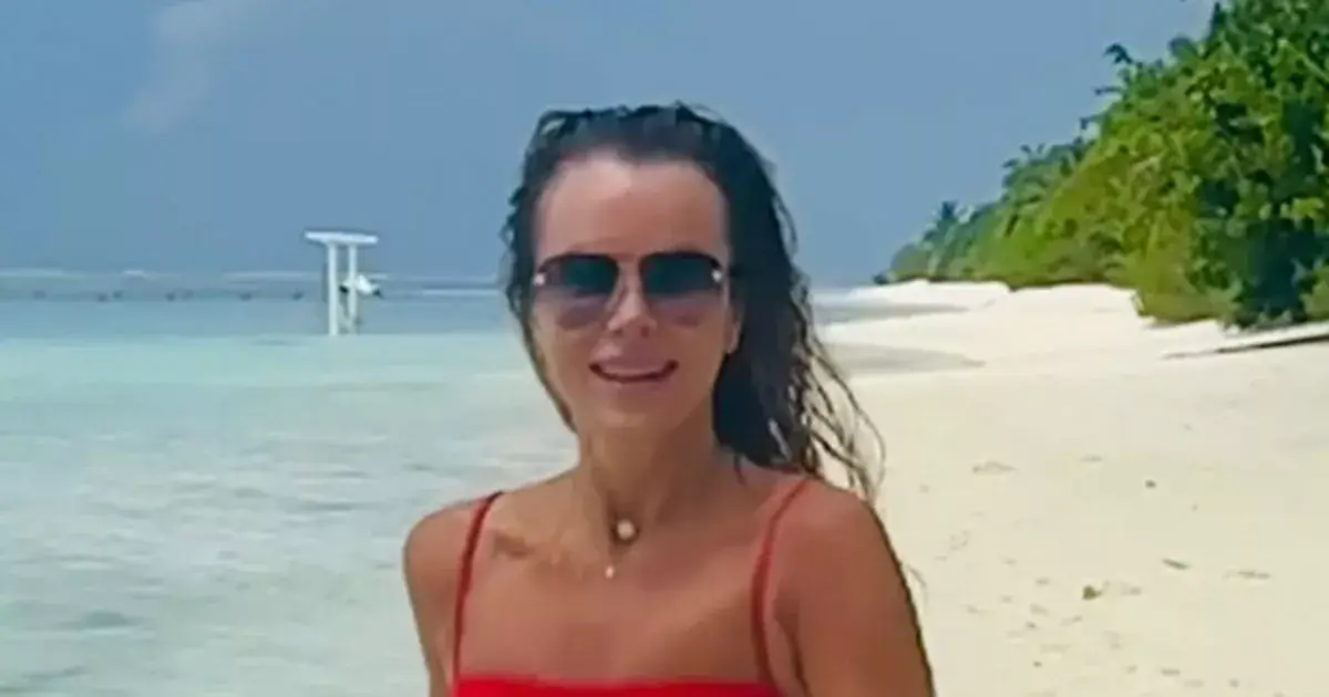 In a tiny red bikini, Amanda Holden showed off her toned physique while running across the beach In a tiny red bikini, Amanda Holden showed off her toned physique while running across the beach