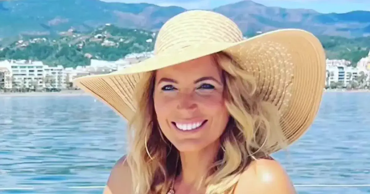 The gorgeous Jasmine Harman, 48, poses in a bright red swimsuit as she shared a sweet snap