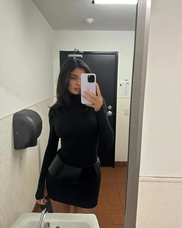 Kylie Jenner has been smokin' hot in brand new selfies that show her rocking a revealing latex dress and a curve-skimming mini skirt .