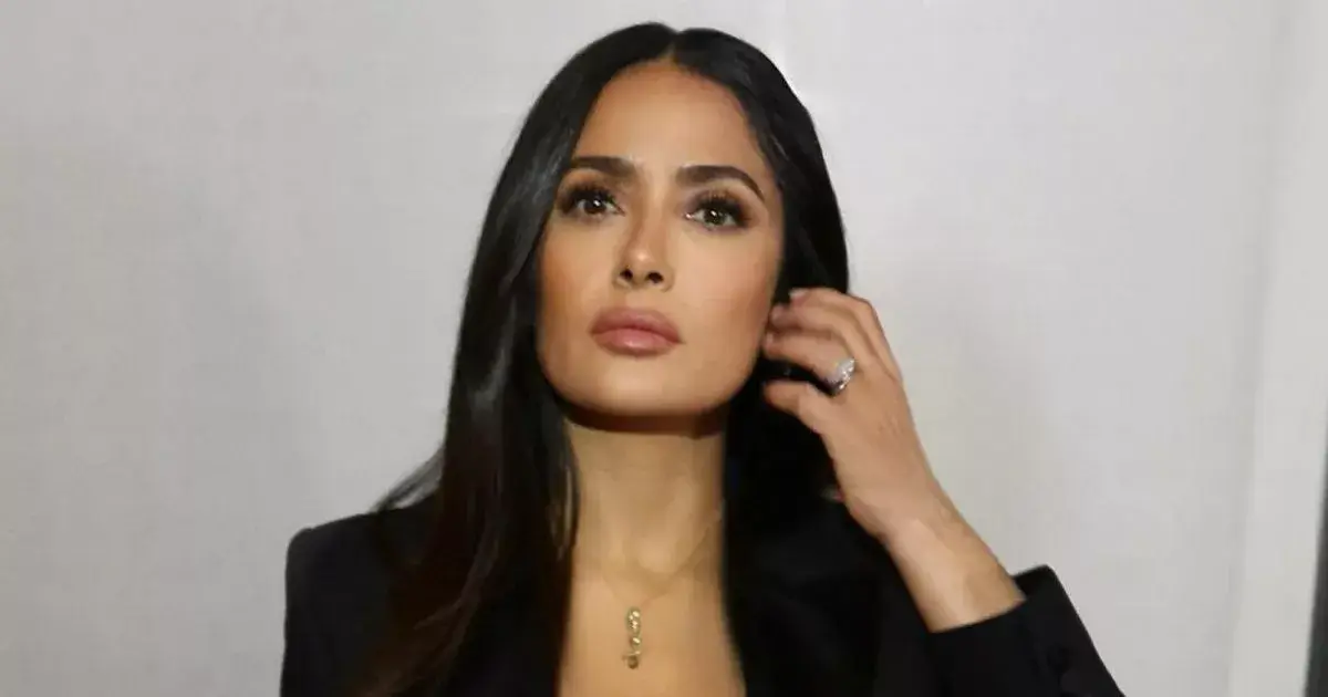 Salma Hayek is looking as stunning as ever in a plunging corset and tight suit jacket that show off her incredible figure