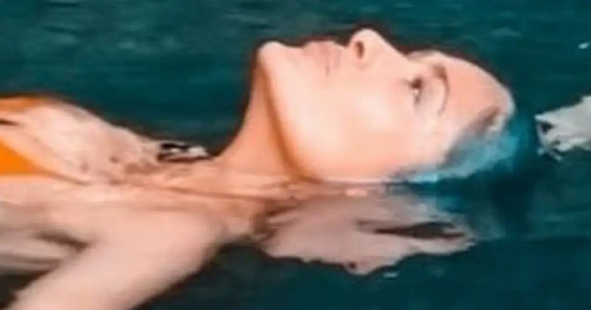 The gorgeous Salma Hayek showed off her impressive figure in a teeny orange bikini while swimming in a cenote