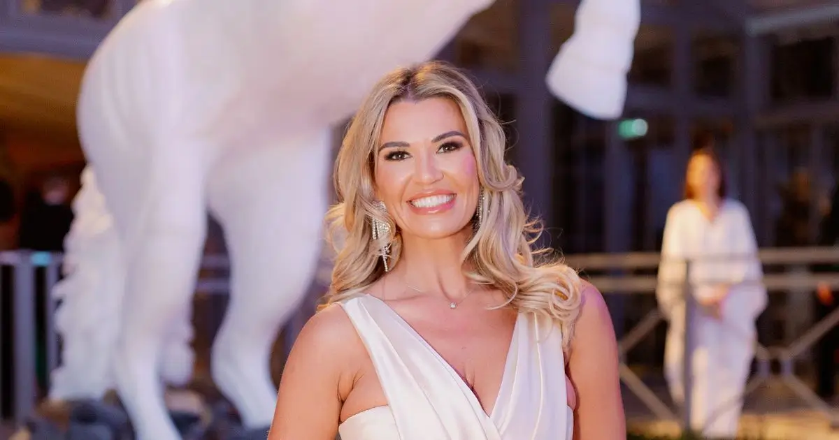 The gorgeous Christine McGuinness was spotted in a white silk gown showing off her famous curves
