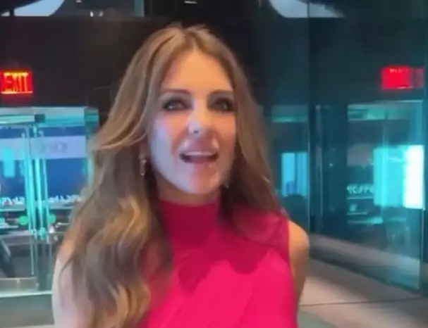 A cheeky chest cut-out puts Liz Hurley at risk of a wardrobe malfunction as she slipped into a boob window dress