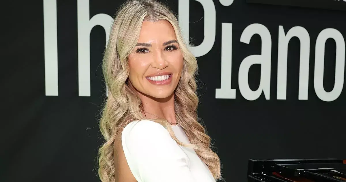 Christine McGuinness flashes underboob in a backless white blouse as she showed off toned figure
