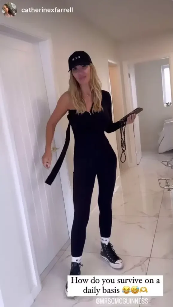 Christine is seen in an Instagram Story standing in a corridor, half-dressed in a black bodysuit with her sleeve dangling.