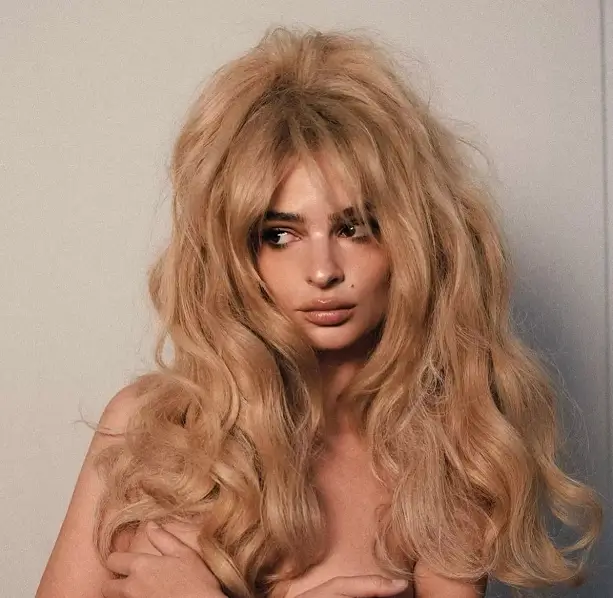 Emily Ratajkowski wows fans with a steamy photoshoot as she stripped off and covers boobs with her own hands while wearing a waist-length blonde wig.