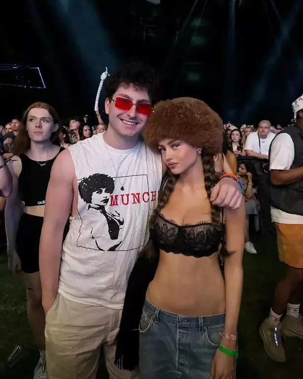 Heidi Klum's daughter Leni Klum dressed in a sheer bra, jeans slung low on her hips and a fur hat while attending Coachella with songwriter Jaden Miller.