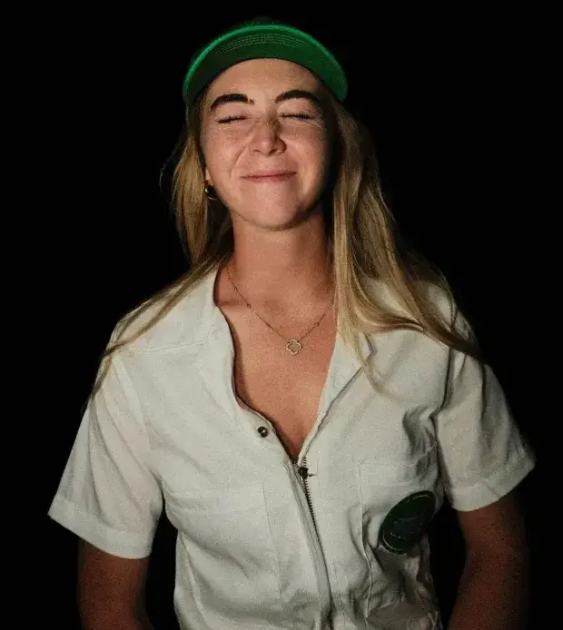 Beauty Grace Charis went completely topless  underneath her green jacket as she got in the Masters mood