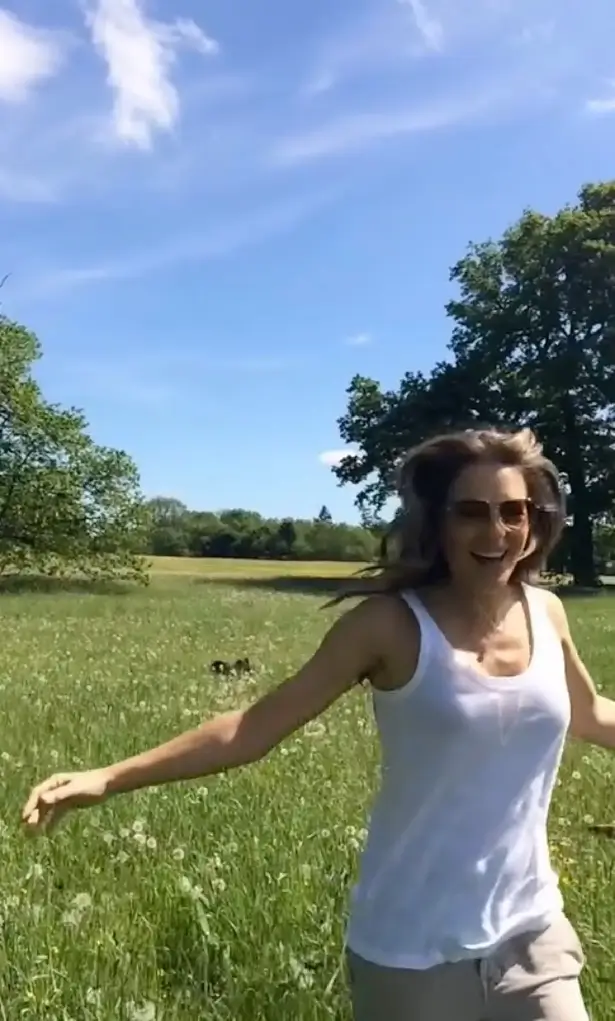 Braless Elizabeth Hurley was swooned by fans as she ran across a lush green field in a see-through top