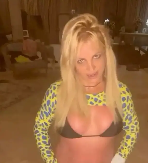 While dancing the night away, Britney Spears donned a sizzling black bikini to show off her ample assets.