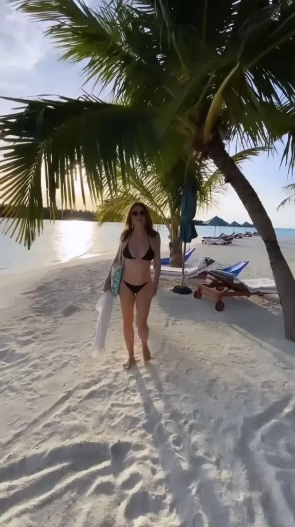 As Elizabeth Hurley stripped down for a beach-side photoshoot in a tiny black two-piece, she got fans hot under the collar.