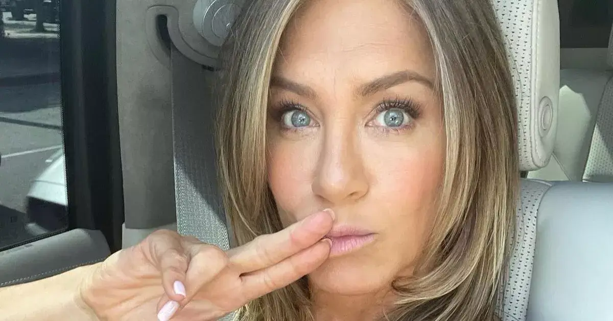 Jennifer Aniston wows in a stunning plunging dress as she shows off ageless beauty in rare snap