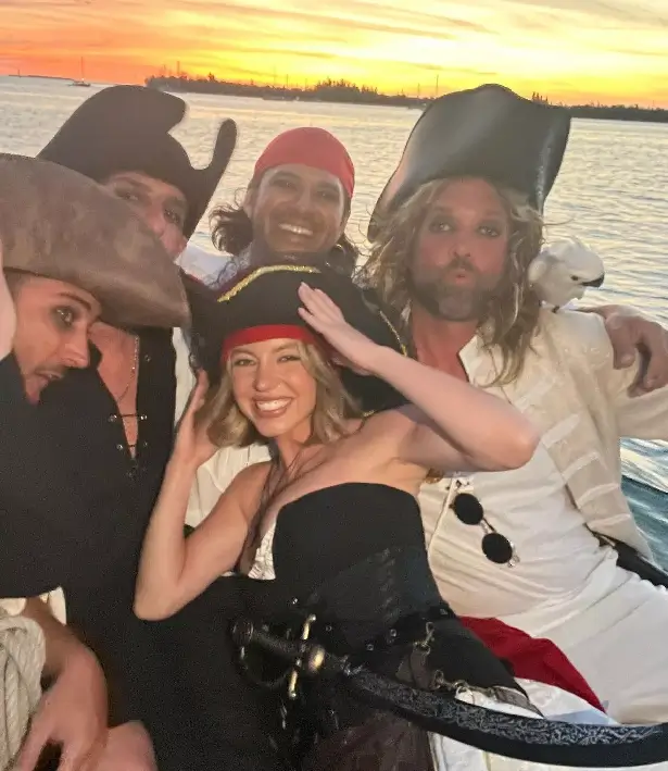 Later in the day, she was seen barefoot posing on the bow of the boat and posing alongside her friends in a sunset photo.