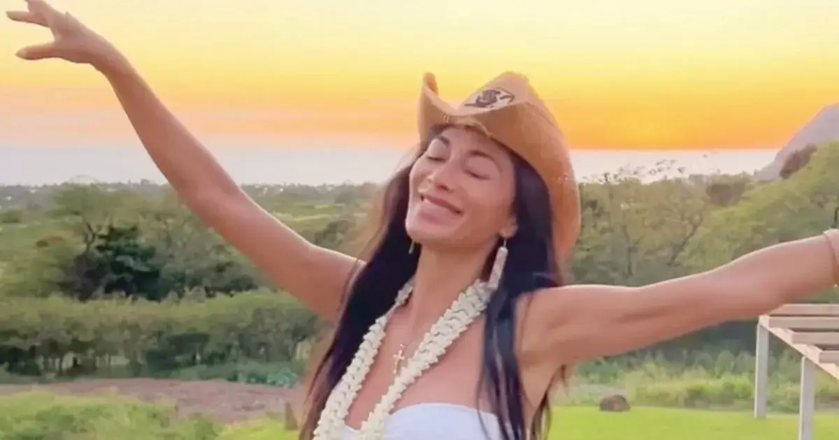 Nicole Scherzinger stunned in a neon green bikini and a large sun hat as she strolled around the island soaking up the sun