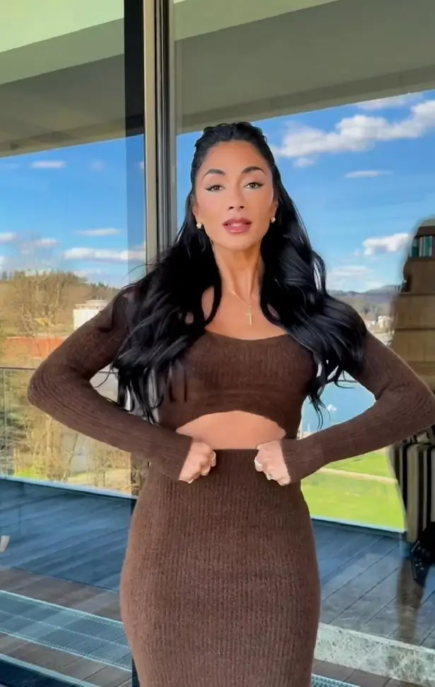 Nicole Scherzinger's new video shows her hugs curves and dancing in a super tight dress