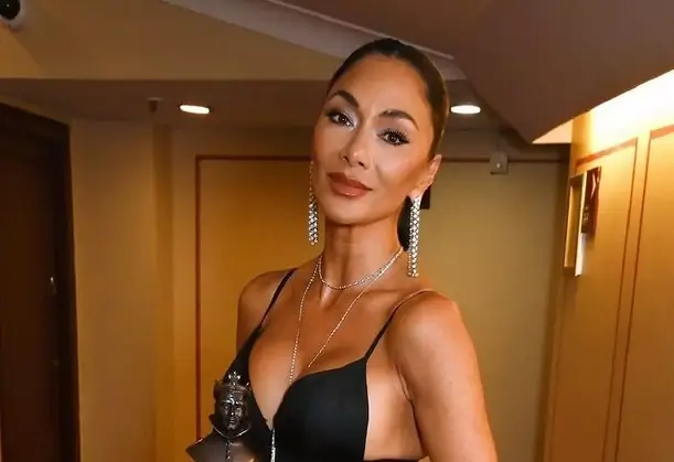 Nicole Scherzinger, 45, barely tames curves in plunging corset dress with thigh slit