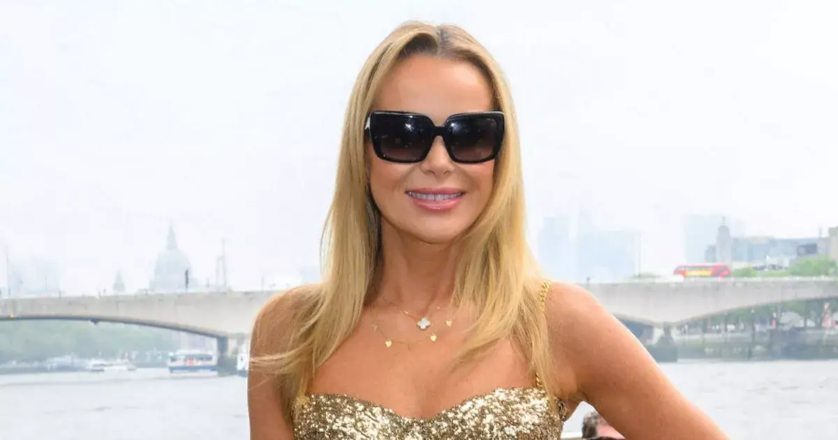 Amanda Holden, 54, shows off her ageless figure in tight gold jumpsuit as she dancing on boat