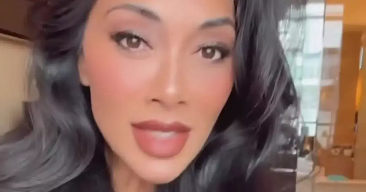 Nicole Scherzinger, 46, strips to just a white robe and films herself in dazzling hotel room clip