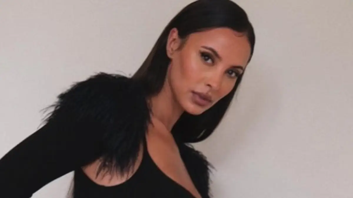 In a figure-hugging black dress with a racy split, Maya Jama shows off her sensational curves for a number of stunning photos