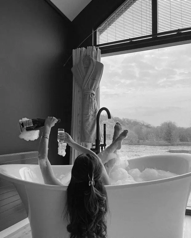 While enjoying a glass of champagne in the bath, Maura Higgins stripped off, letting her brunette locks flow over the rim of the tub.