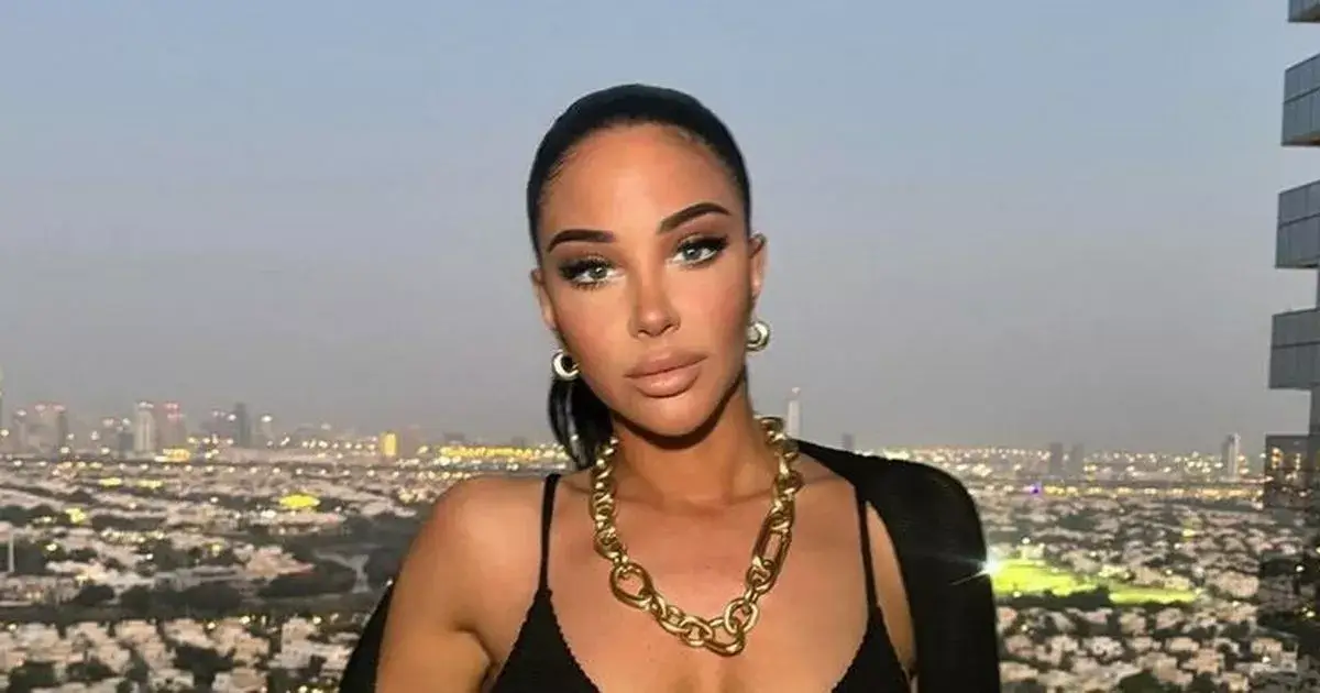 N-Dubz beauty Tulisa showed off her ample assets in a stunning black bikini while giving a sneak peek into her luxurious vacation with friends