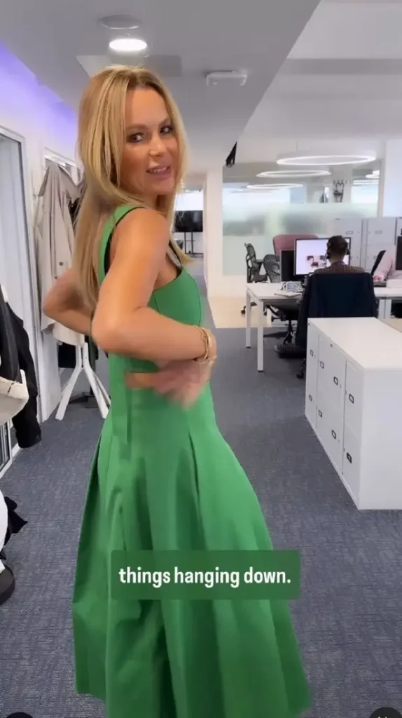An office ensemble of green pants, green heels, and a strappy crop top showed off Amanda's toned tummy and ageless figure.